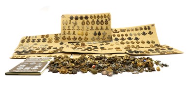 Lot 142 - A collection of military badges and buttons