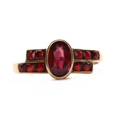 Lot 112 - A Hungarian oval mixed cut garnet ring