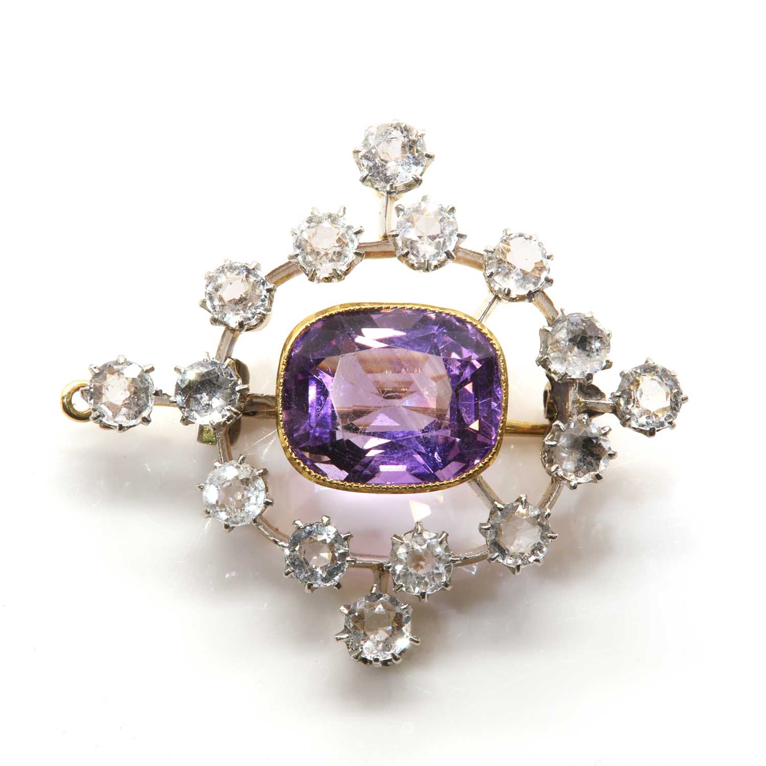 Lot 73 - An Edwardian amethyst and white topaz, open lozenge form, brooch/pendant