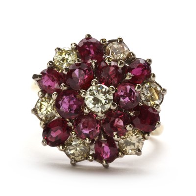 Lot 99 - An 18ct gold ruby and diamond cluster ring