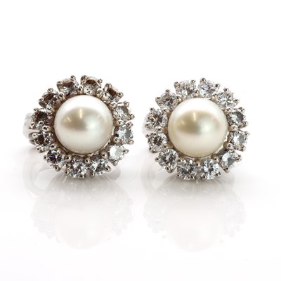 Lot 222 - A pair of platinum cultured pearl and diamond cluster clip earrings, by Cartier