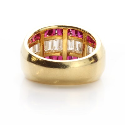 Lot 86 - A Continental diamond and ruby half hoop ring