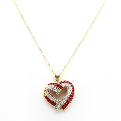 Lot 388 - A Continental diamond and ruby heart shaped pendant