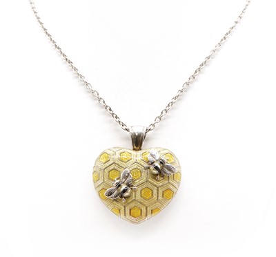 Lot 381 - A sterling silver enamelled 'bee on honeycomb' pendant, by Theo Fennell, c.2011