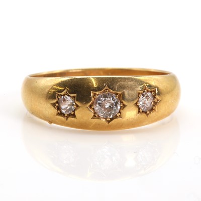 Lot 125 - An 18ct gold three stone diamond gypsy ring