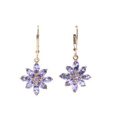 Lot 143 - A pair of gold tanzanite and diamond earrings