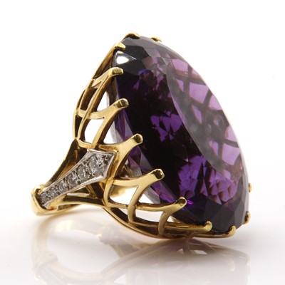 Lot 199 - An 18ct gold single stone amethyst ring with diamond set shoulders, c.1970