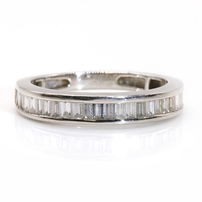 Lot 304 - A platinum baguette cut diamond half eternity ring, by Rhapsody