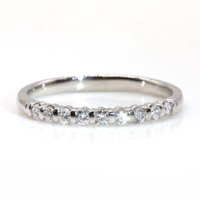 Lot 301 - A platinum diamond set half eternity ring