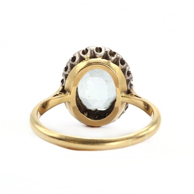 Lot 115 - An 18ct blue topaz and diamond cluster ring