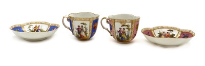 Lot 223 - A near pair of Dresden cabinet cups and saucers