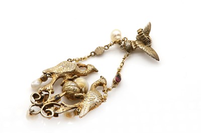 Lot 94 - A renaissance revival silver gilt foiled garnet, blister pearl and enamel pendant, c.1900