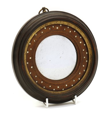 Lot 334 - An Anglo-Indian porthole mirror