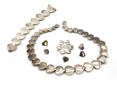 Lot 455 - A Danish sterling silver necklace, bracelet, brooch and buttons heart suite, by Hans Hansen, c.1930-1950