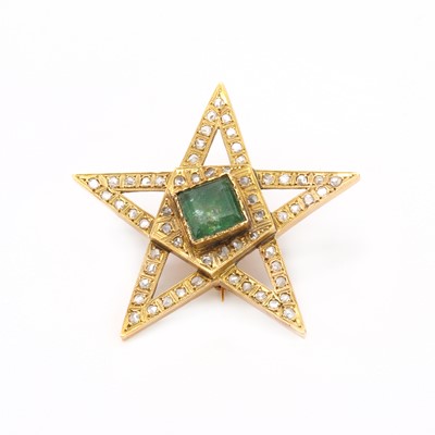 Lot 98 - A gold emerald and diamond star brooch