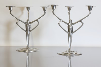 Lot 140 - A pair of pewter candelabra