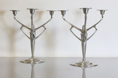 Lot 140 - A pair of pewter candelabra