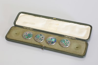 Lot 117 - Four silver and enamelled 'Cymric' buttons