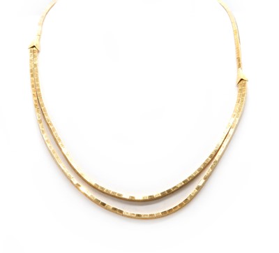 Lot 186 - An Italian gold graduated necklace and bracelet, by UnoAerre, c.1960