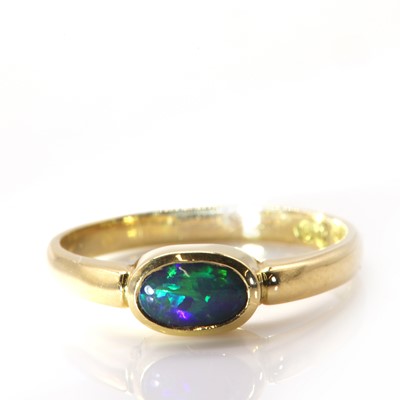 Lot 343 - A single stone black opal ring