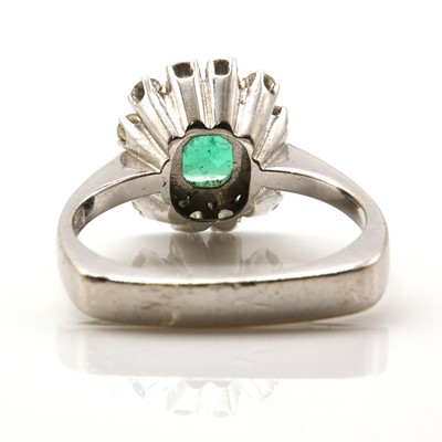 Lot 103 - A Continental emerald and diamond square cluster ring