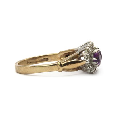 Lot 128 - A 9ct gold amethyst and diamond three stone cluster ring