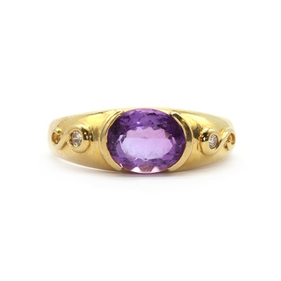 Lot 141 - An 18ct gold amethyst and diamond three stone ring