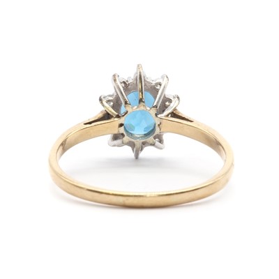 Lot 117 - A 9ct gold topaz and diamond cluster ring