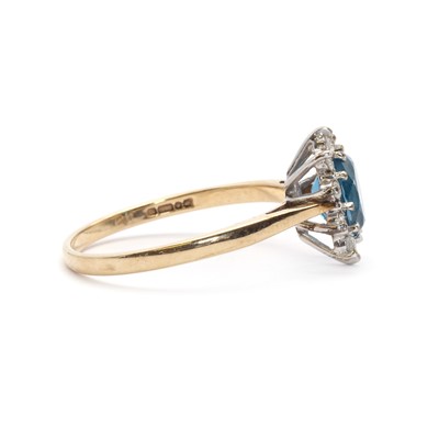Lot 117 - A 9ct gold topaz and diamond cluster ring