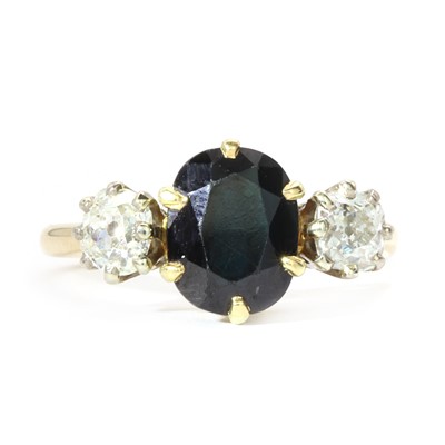 Lot 103 - A gold  three stone sapphire and diamond ring