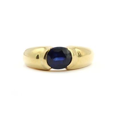 Lot 96 - A gold single stone sapphire ring