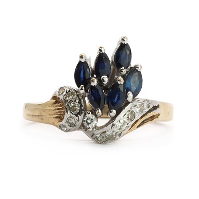 Lot 89 - A 9ct two colour gold sapphire and diamond spray cluster ring