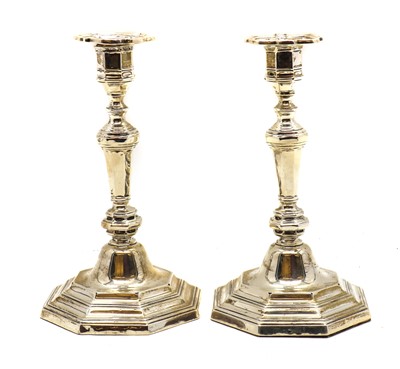 Lot 61 - A pair of Queen Anne style silver candlesticks