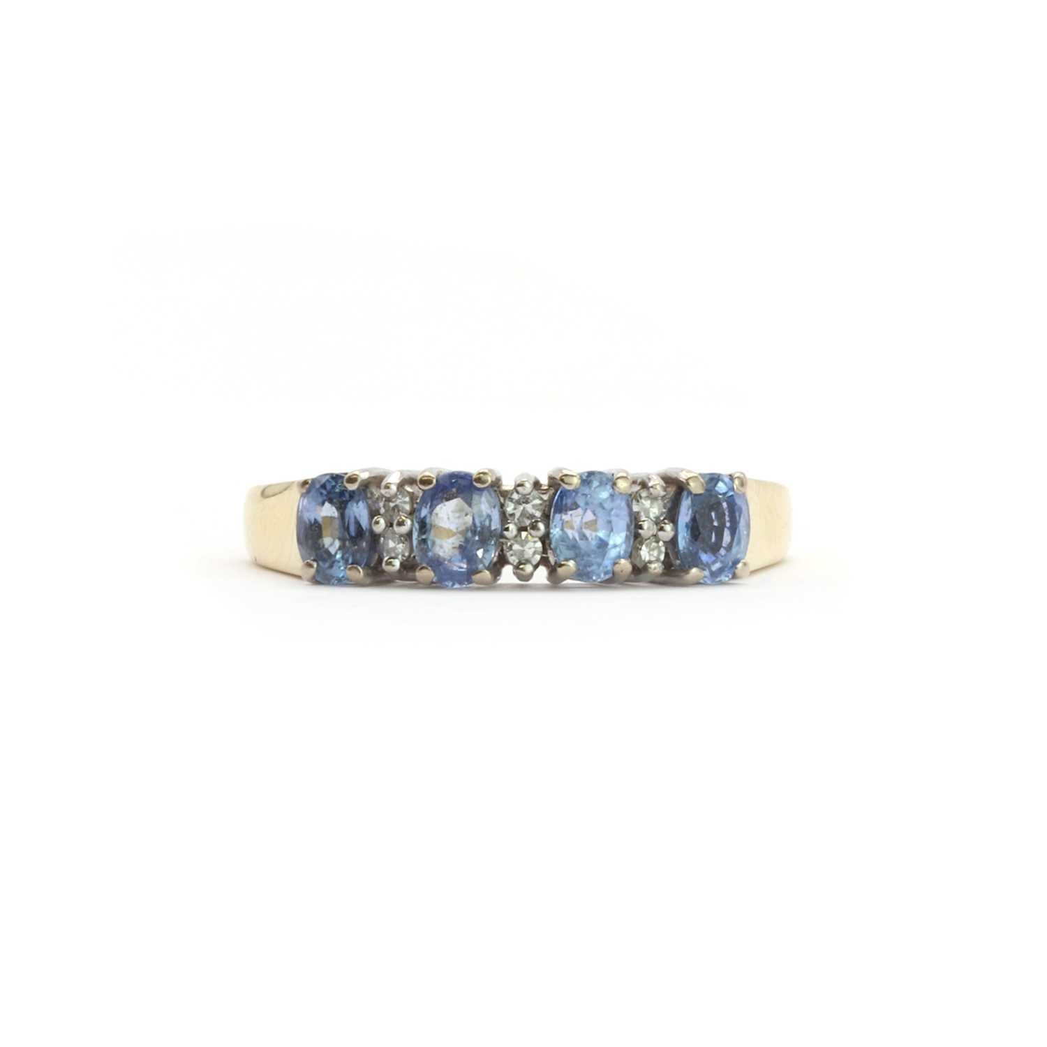 Lot 107 - An 18ct gold sapphire and diamond half eternity ring