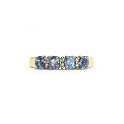 Lot 107 - An 18ct gold sapphire and diamond half eternity ring