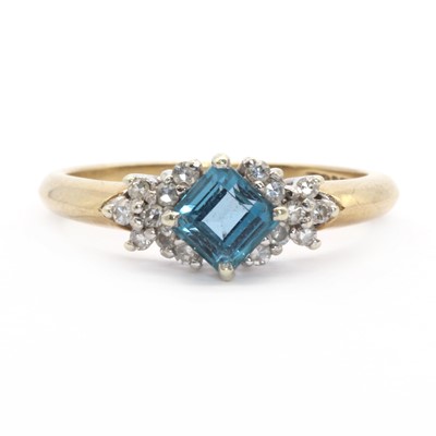 Lot 124 - A 9ct gold topaz and diamond ring