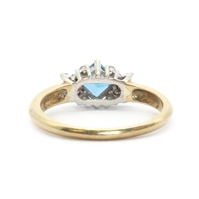 Lot 124 - A 9ct gold topaz and diamond ring