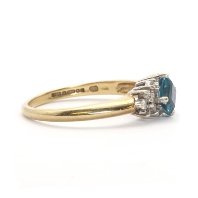 Lot 124 - A 9ct gold topaz and diamond ring