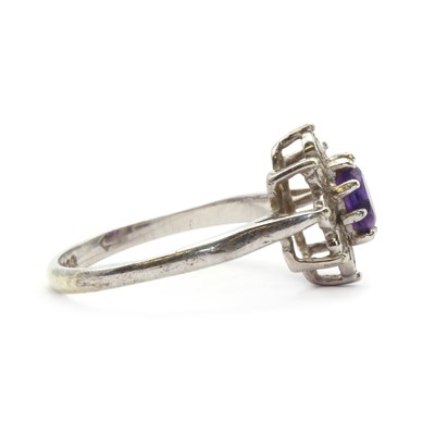 Lot 134 - A 9ct white gold amethyst and diamond cluster ring