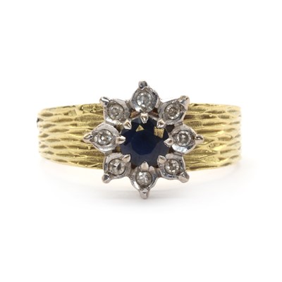 Lot 97 - An 18ct gold sapphire and diamond floral cluster ring