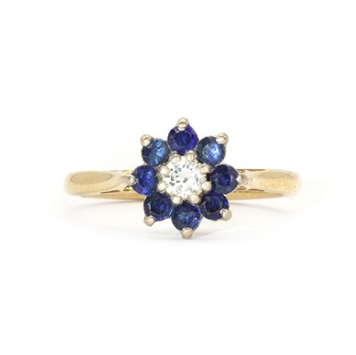 Lot 92 - An 18ct gold sapphire and diamond cluster ring