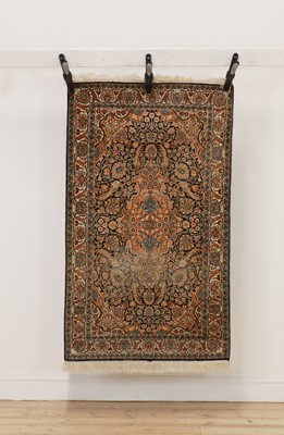Lot 282 - A hand knotted silk Persian rug