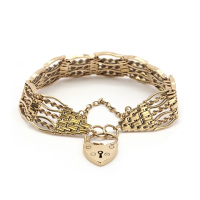 Lot 145 - A 9ct gold seven row gate bracelet