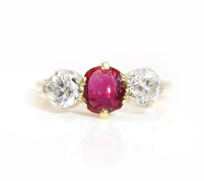 Lot 413 - An 18ct gold ruby and diamond three stone ring