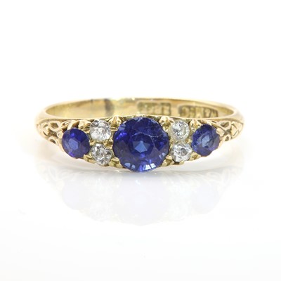 Lot 87 - A sapphire and diamond carved head ring, c.1900
