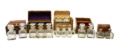Lot 158 - A collection of five cased travelling scent bottles