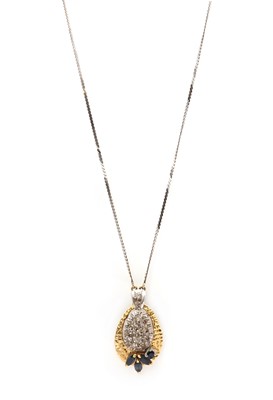 Lot 93 - A two colour gold diamond and sapphire pendant