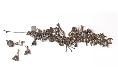 Lot 180 - A silver charm bracelet