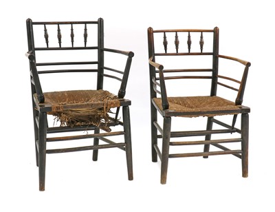 Lot 106 - A near pair of Sussex open armchairs
