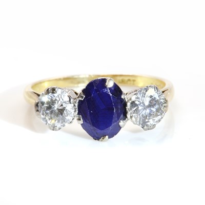 Lot 412 - A sapphire and diamond three stone ring